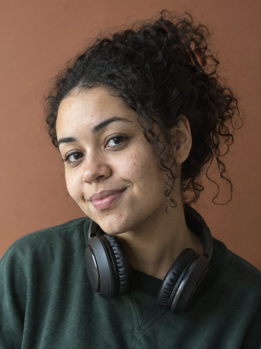 Daniela, engineering, with her headphones around her neck