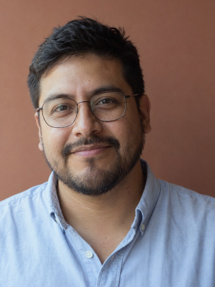 Andrés, finance and accounting, in glasses and a light blue shirt